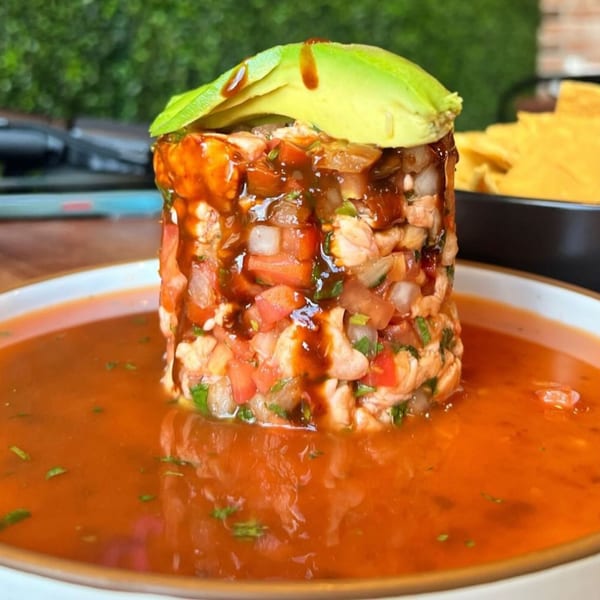 Amelia's Mexican Kitchen ceviche tower with shrimp, pico de gallo, avocado, and red sauce.