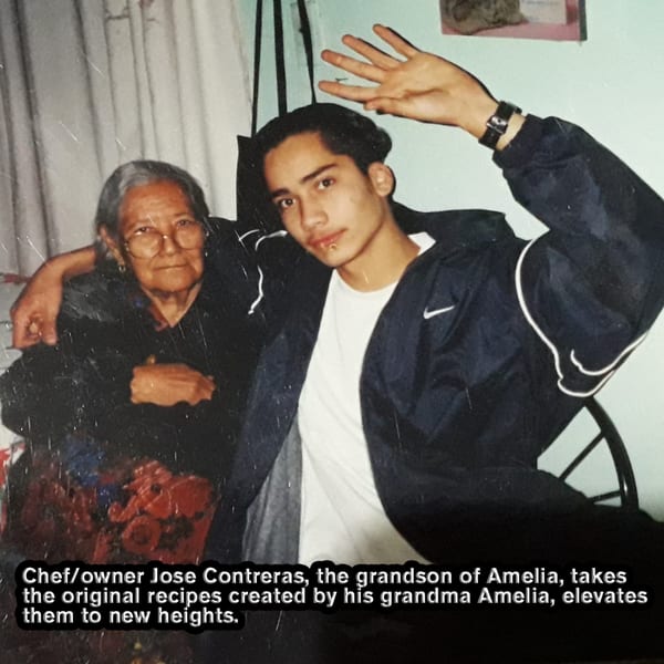 Amelia's grandson, Jose Contreras, with his arm around her, both smiling at the camera.